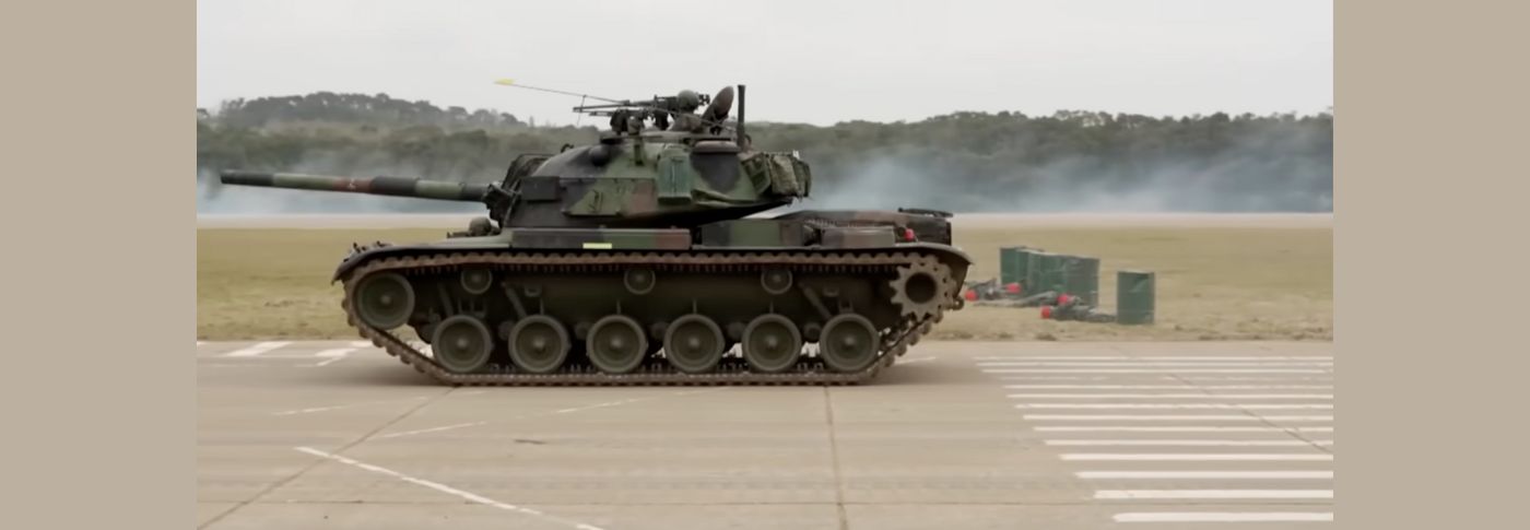Military tank in motion during a training exercise, illustrating U.S. weapons support for Taiwan amid rising tensions with China.